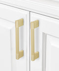 10 Pack Brushed Brass Knurled Cabinet Handles 5 Inch Center to Center 5.9 Inch Overall Length installed on white cabinets