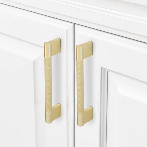 10 Pack Brushed Brass Knurled Cabinet Handles 5 Inch Center to Center 5.9 Inch Overall Length installed on white cabinets