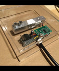 Four Piece Digital Load Cell Kit With HX711 ADC Module For Arduino DIY Portable Kitchen Scale 5kg Weight Sensor Set Beginner Friendly Easy To Use Home Project Ideal For Prototyping And Education. 5kg load cell with HX711 board on clear acrylic scale base