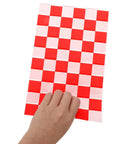 Hand holding Race Car Themed Gift Bags With Handle Pack Of 50 Portable Lightweight Plastic Candy Bags Checkered Pattern