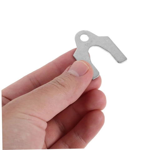 Hand holding steel shim spacer from Auto Body Panel Tool Kit With Steel Shim Spacers For Precise Sheet Metal Alignment And Vehicle Door Gaps Weather Resistant Shim Set For DIY And Professional Use 144 Piece Universal Gap And Alignment Kit.