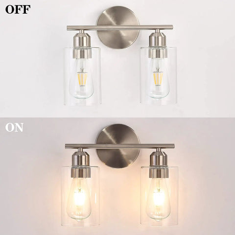 Two Light Brushed Nickel Bathroom Vanity Light with clear glass shades shown on and off, indoor wall sconce fixture.