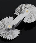 Front view of a metal 58-piece screw thread pitch gauge set with metric and imperial blades folded into a circular fan