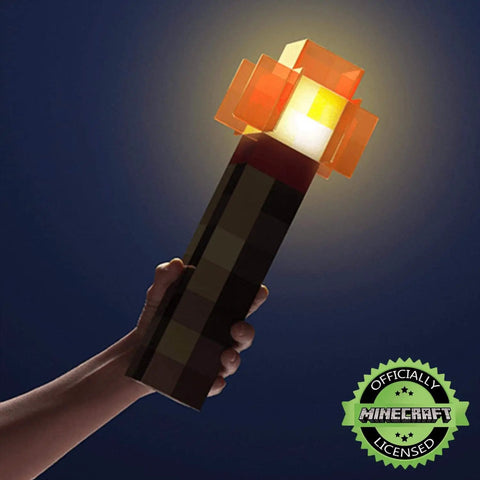 Person holding Redstone Torch LED Lamp 12.6 Inch USB Rechargeable Nightlight For Gaming Setup Cosplay And Roleplay Orange Official Collectible Desk Light For Home Decor