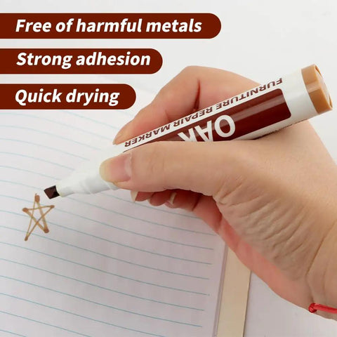 Hand using an oak wood repair marker for quick dry, non-toxic ink application on paper for DIY projects.