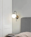 Upgrade Your Vibe With Sleek Brass Wall Sconces Featuring Handcrafted White Glass Globe Shades Ideal For Modern Farmhouse And Bedroom Lighting E27 Socket with round globe.