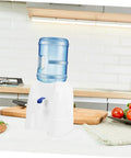 Portable Water Dispenser And Compact Bucket Holder Faucet For Outdoor Camping And RV Use on kitchen countertop