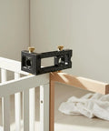 Premium Adjustable Hole Positioning Jig With Stainless Steel Sleeves For Accurate Doweling And Cabinet Assembly positioned on a wood joint.