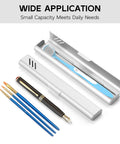 Sturdy Aluminum Travel Toothbrush Case With Dual Ventilation open with toothbrush, slim silver finish, next to pens and brushes