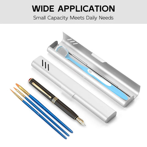 Sturdy Aluminum Travel Toothbrush Case With Dual Ventilation open with toothbrush, slim silver finish, next to pens and brushes