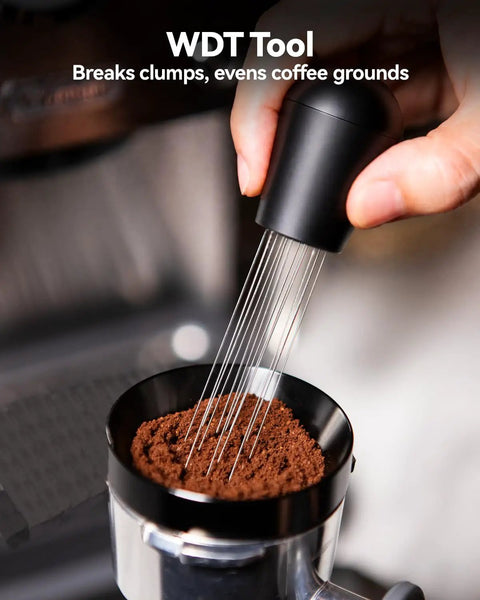 WDT tool used for even coffee grounds, featuring multiple needles and a black ergonomic handle in an espresso setup.
