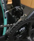 Close-up of budget friendly road bike front derailleur clip ring type for 31.8 to 34.9 mm tube size, aluminum alloy Shimano R2000 compatible.