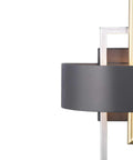 Close-up of Adagio Collection 2 Light Black Modern Wall Light with geometric interlocking brass and silver elements, side view.