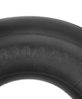 Close-up of black 4 Pack 4.10/3.50-4 Inner Tubes With TR87 Bent Valve Stem 10 Inch Heavy Duty Replacement for small equipment tire.