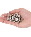 Hand holding 50 Piece M6 Furniture Bolt And Nut Kit with silver hex drive nuts and bolts for beds, shelves, bunk beds, and DIY home projects.