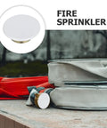 Sleek Iron Fire Sprinkler Nozzle Cover Plate With Tough Head Protector and Snug Ceiling Escutcheon on a surface.