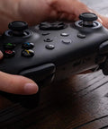 Hands holding Wireless Gaming Controller For Windows PC Mac Steam And Android With TMR Joysticks Hall Triggers Motion Control RGB Fire