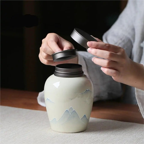 Ceramic Sugar Jar With Airtight Lock Lid For Storing Loose Tea Coffee Beans And Nuts Vintage Kitchen Food Storage Container being opened.