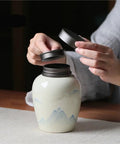Top Shelf Ceramic Tea Storage Jar With Hella Secure Lid For Loose Leaf And Daily Coffee Beans Vintage Kitchen Caddy being opened.