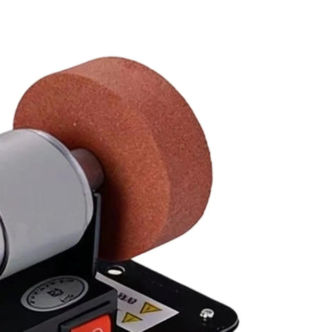 Built Different Mini Bench Grinder With Knockout Torque From A Copper Brushless Motor Shreds Through Metal And Wood Sharpening Tasks, close-up view of grinding wheel.