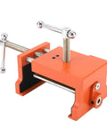 Badass Cabinet Clamps 2 Pack For Real Woodworking Projects With Flip Side Pilot Drill Guide Heavy Duty Aluminum Build 440 Pound Holding Power Fits One Point Five To Two Inch Door Stiles close-up of a heavy-duty orange cabinet clamp showing screw mechanism and rubber pads.