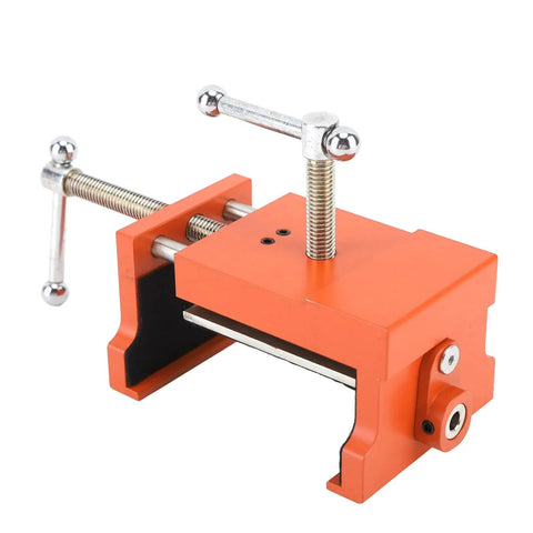 Badass Cabinet Clamps 2 Pack For Real Woodworking Projects With Flip Side Pilot Drill Guide Heavy Duty Aluminum Build 440 Pound Holding Power Fits One Point Five To Two Inch Door Stiles close-up of a heavy-duty orange cabinet clamp showing screw mechanism and rubber pads.