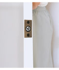 Cool And Sturdy Ball Catch For Top Of Door With Built-In Spring Invisible Latch shown in cabinet door with brass finish.