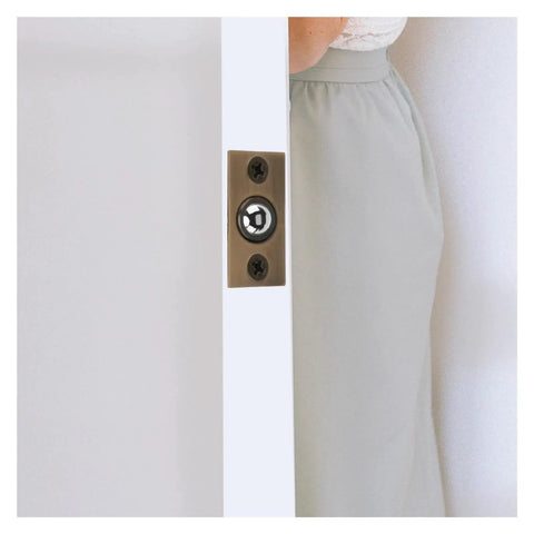 Cool And Sturdy Ball Catch For Top Of Door With Built-In Spring Invisible Latch shown in cabinet door with brass finish.