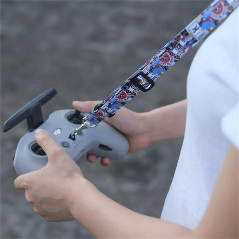 Adjustable Anti Drop Lanyard Neck Strap For FPV Transmitters And Drone Controllers Soft Polyester Comfort Snug Fit For Avata 2 Avata FPV Controller 3 2 Phantom 3 4 Remote attached to a gray controller in hands