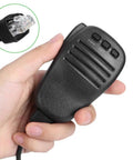 Person holding Handheld Microphone Speaker For Two Way Radios Compatible With Yaesu FT 817 FT 900 FT 450D, showing plug detail.