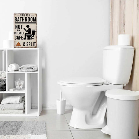 Kickass Vintage Metal Tin Sign 8X12 Inches With A Heck Funny Bathroom Wall Art And Farmhouse Humor Plaque hung near toilet in modern bathroom.