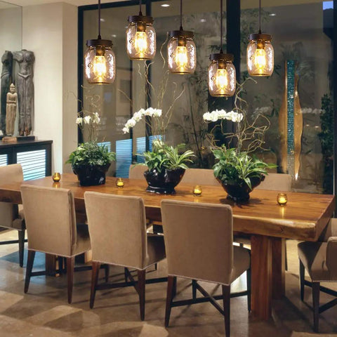 Five-Light Mason Jar Chandelier For Kitchen Island Farmhouse Linear Pendant Light Fixture With Matte Black Finish And Glass Shades Over Dining Table