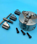Solid K11-100 Mini 100MM Lathe Chuck With Three Self Centering Jaws For Metalworking Projects, includes jaws and accessories.