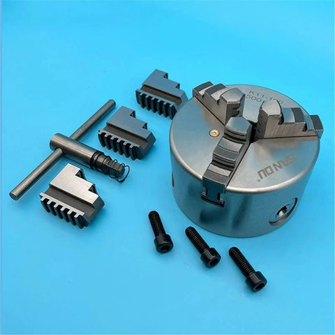 Solid K11-100 Mini 100MM Lathe Chuck With Three Self Centering Jaws For Metalworking Projects, includes jaws and accessories.