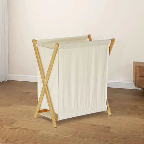 Collapsible Bamboo Wood Laundry Hamper With X Frame Foldable Laundry Basket And Linen Canvas Bag, 50L, in bedroom setting