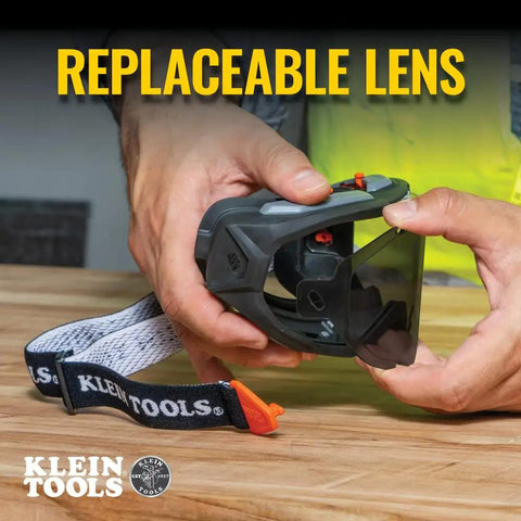 Hands adjusting Tinted Safety Goggles With Anti Fog Lens For Pro Grade Eye Protection, Scratch Resistant UV Shield.