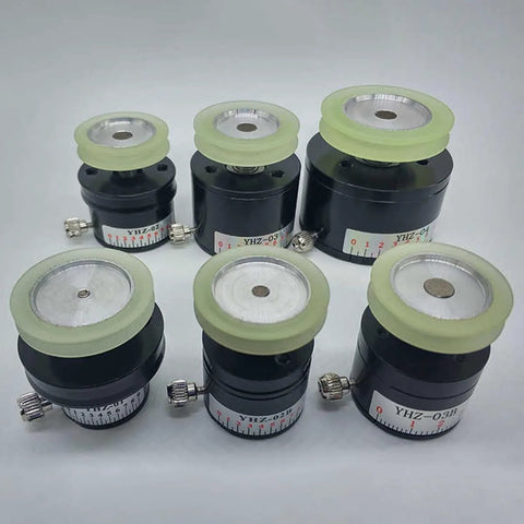 Six black YHZ magnetic dampers with white dial scales and pale yellow tops
