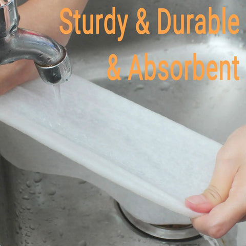 Hand holding Go To Reusable Bamboo Paper Towels 4 Rolls 80 Sheets Heavy Duty Machine Washable under running water in sink