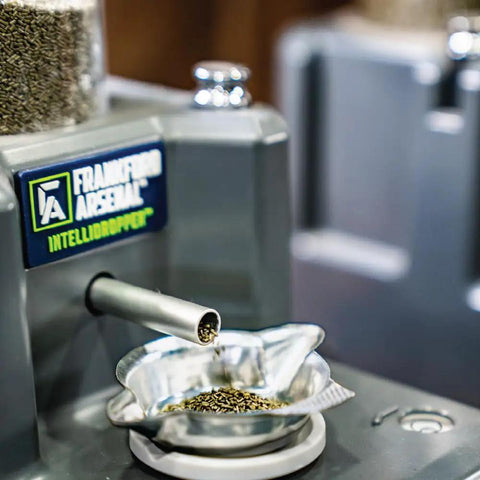 Close-up of Intellidropper Electronic Powder Measure With Auto And Manual Trickle, 0.1 Grain Accuracy, dispensing powder into a dish.