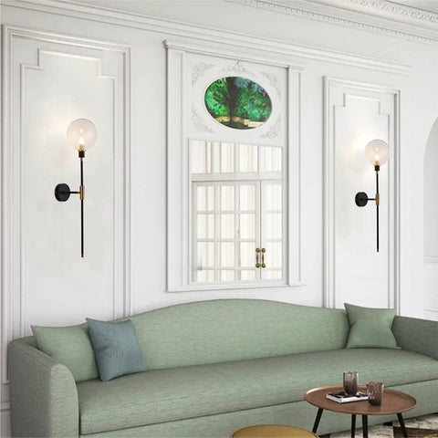 Industrial Gold And Black 1 Light Wall Sconce With Long Arm And Globe Glass Shade Delivers A Lit Glow Modern Wall Mounted Lamp For Bedroom Hallway Clear Glass Set Of 2 displayed in living room