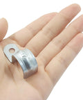 Heavy Duty Reusable 1/2 Inch EMT Conduit Clamps Zinc Plated Steel Rigid Pipe Straps held in hand for indoor outdoor use.
