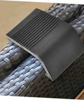 Black plastic Zerodeko 10Pcs Outdoor Wicker Clips Rattan Sofa Fasteners securing two rattan pieces together on a sectional chair.