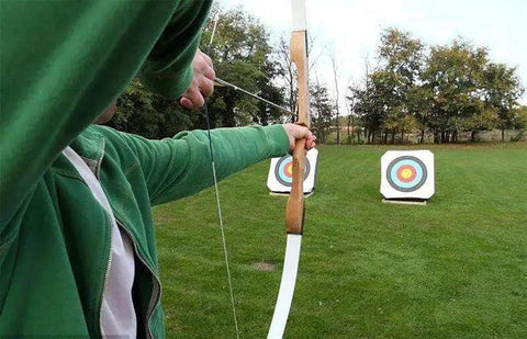 Archer aiming at targets with bow using 24 Pack Steel 100 Grain Arrow Field Points Screw In Practice Target Tips For Recurve Bow Compound Bow And Crossbow Bolts Built Tough And Rust Resistant For Training And Hunting.