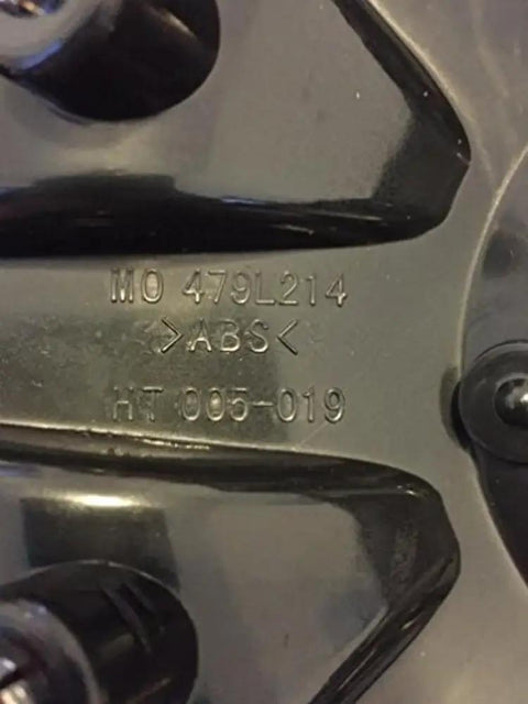 Close-up of Black Wheel Center Cap 479L214 HT 005-019 Replacement Dope Look No Screws Included, showing model number engraving