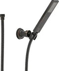 Vero Wall Mount Hand Shower In Venetian Bronze With 69 Inch Hose, mounted on wall, featuring slick modern design.