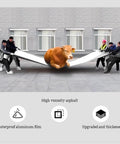 Rock Solid Self Adhesive Waterproof Membrane Roll showcased as workers pull a large sheet while a cow rests on it.