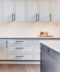 Modern kitchen with white cabinets featuring matte black cabinet pulls 5 inch 128mm hole centers set of 10 durable metal construction