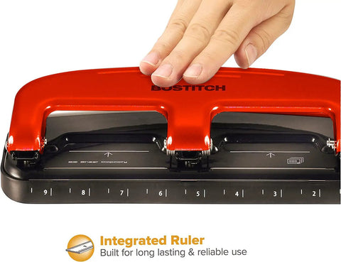 Three Hole Punch With PaperPro EZ Squeeze Technology Delivers 20 Sheet Capacity No Jam Action Easy Peasy Paper Punching Built In Paper Guide Easy Empty Chip Tray Red Finish, showing integrated ruler detail.
