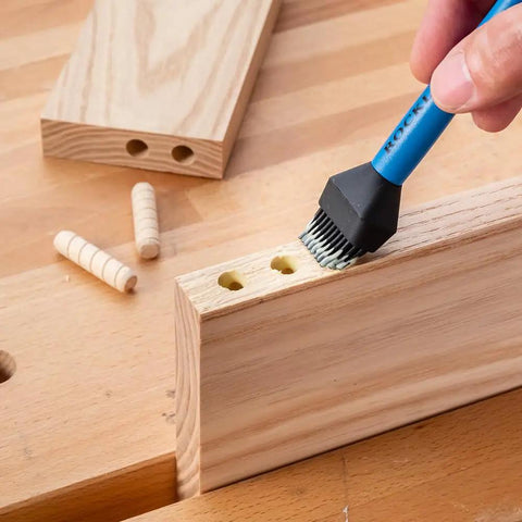 Silicone Glue Brush Kit For Woodworking, Dual Ended Dowel Glue Applicator on wooden surface with dowel holes