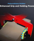 Beast Mode Heavy Duty Steel Lifting Dolly With Ergonomic Rubber Grip Handle And 360 Rotating Hook For Smooth Moving Of Heavy Loads In Home Garage Or Industrial Workshop Ensures Easy Transport Every Time With Zero Back Pain Or Stressful Work. red steel clamp with polyurethane rubber grip holding a box